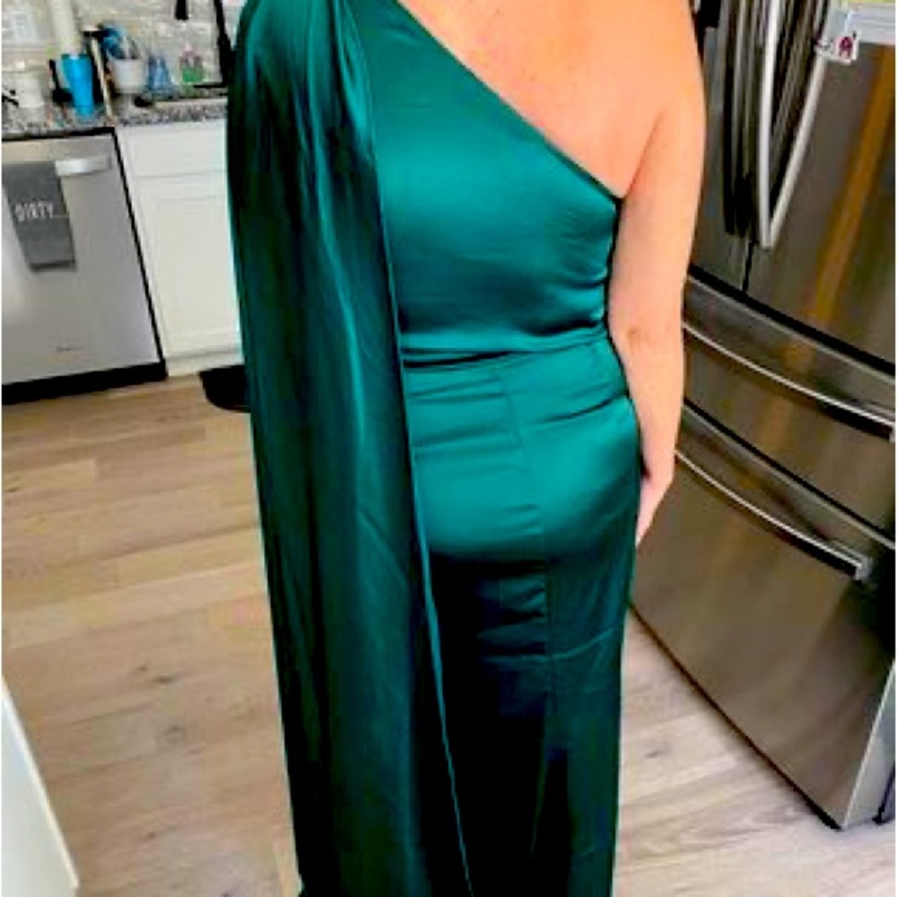 Never worn formal could be altered to remove longer cape edge or shorten dress